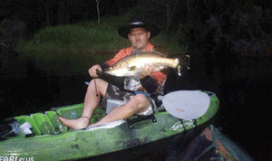 Mark with his first fish from a yak.