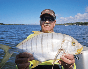 This beautifully marked golden trevally smashed a small Pontoon21 lure trolled around a bait school.