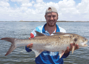 Mathew Hubbard and a threadfin landed at the start of the year. The fish was tagged and released.