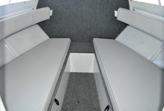 The cabin bunks provide plenty of sleeping room and storage.