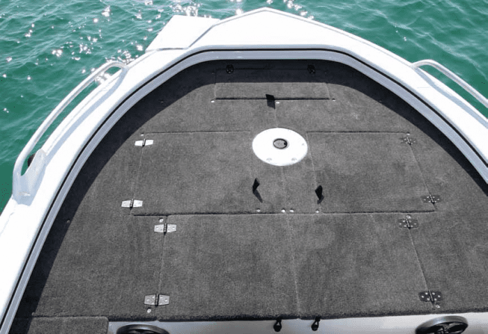 Massive front casting deck with storage hatches, anchor hatch and live well.