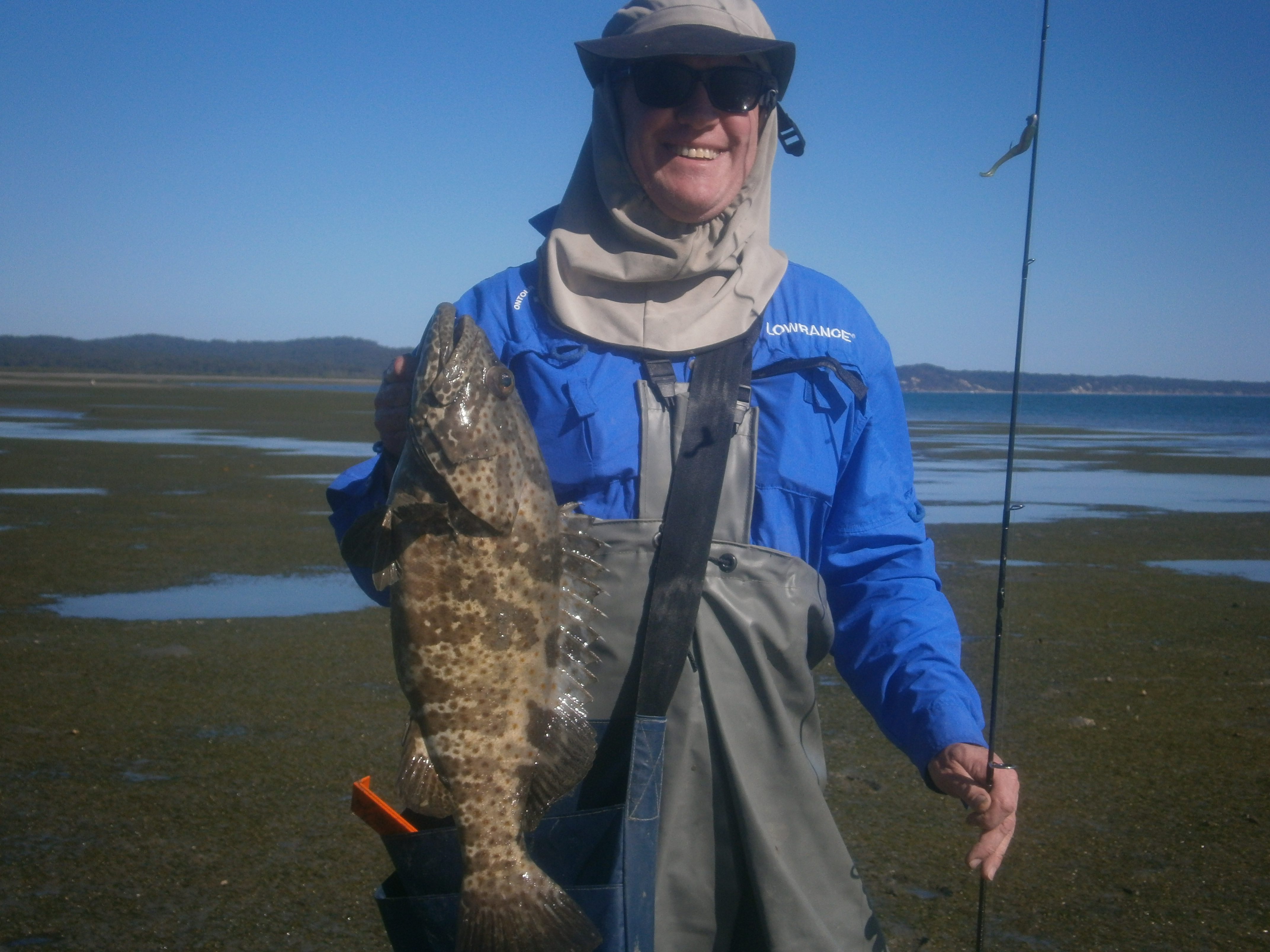 Rossco with a 61cm estuary cod, which is a great catch on light gear from the flats.