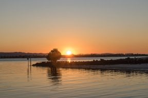 The author’s sunset view looking back towards the mainland. Photo: Bill Hossack