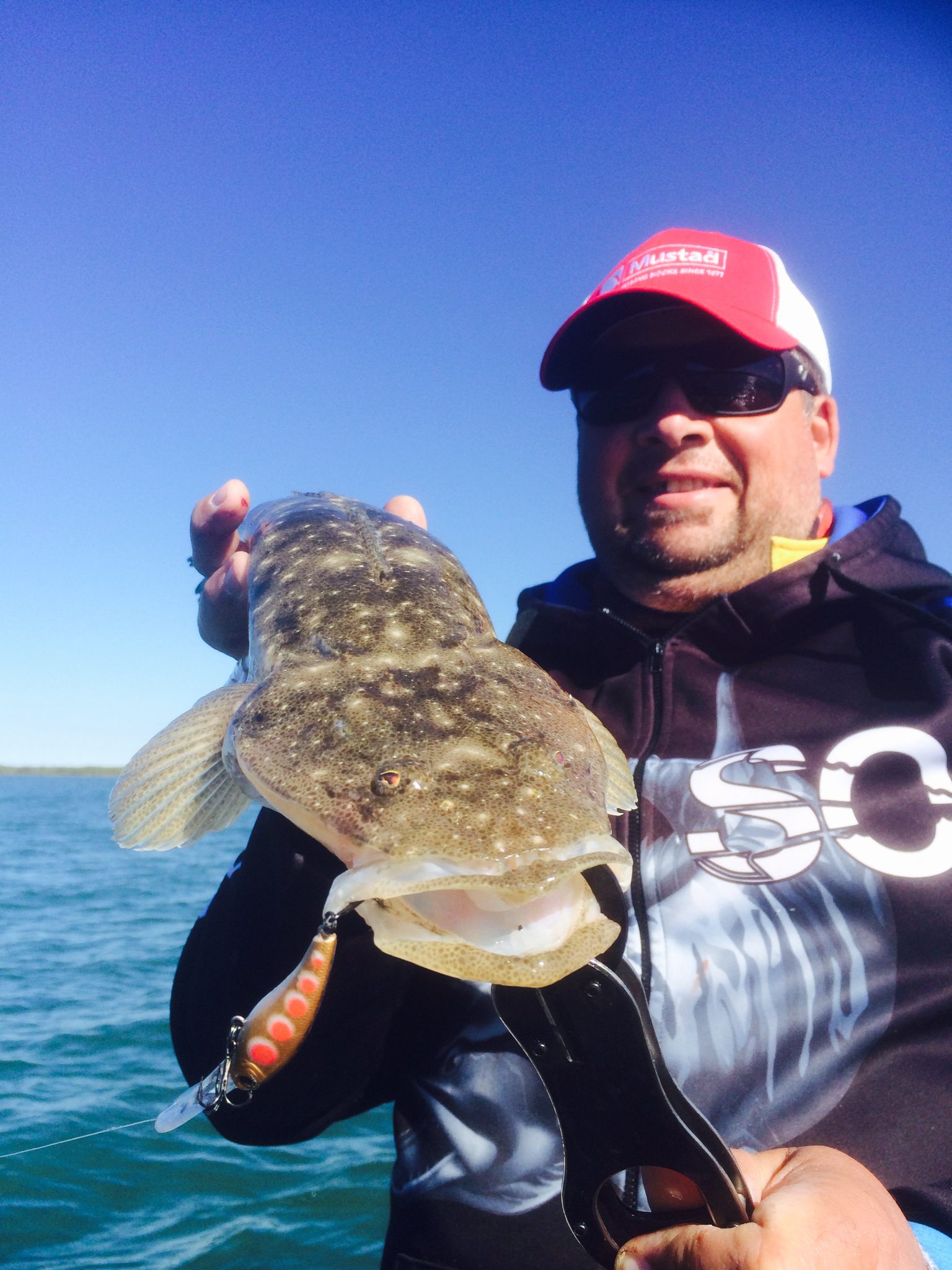 Troy with a nice Flathead taken while trolling on a sand bank at high tide on one of the new zerek tango shads.