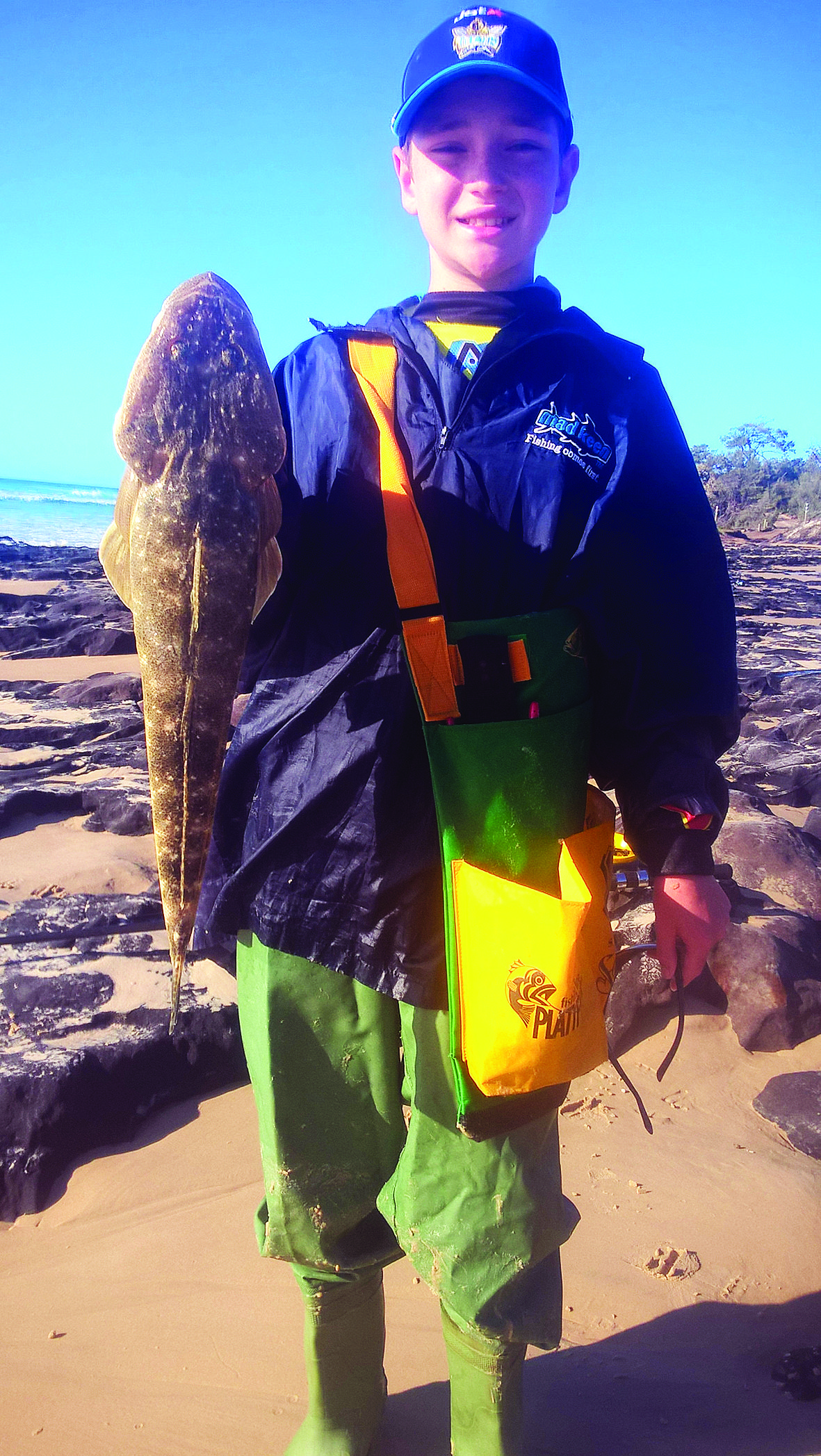 The author’s son with a lovely 60cm flatty from the surf.