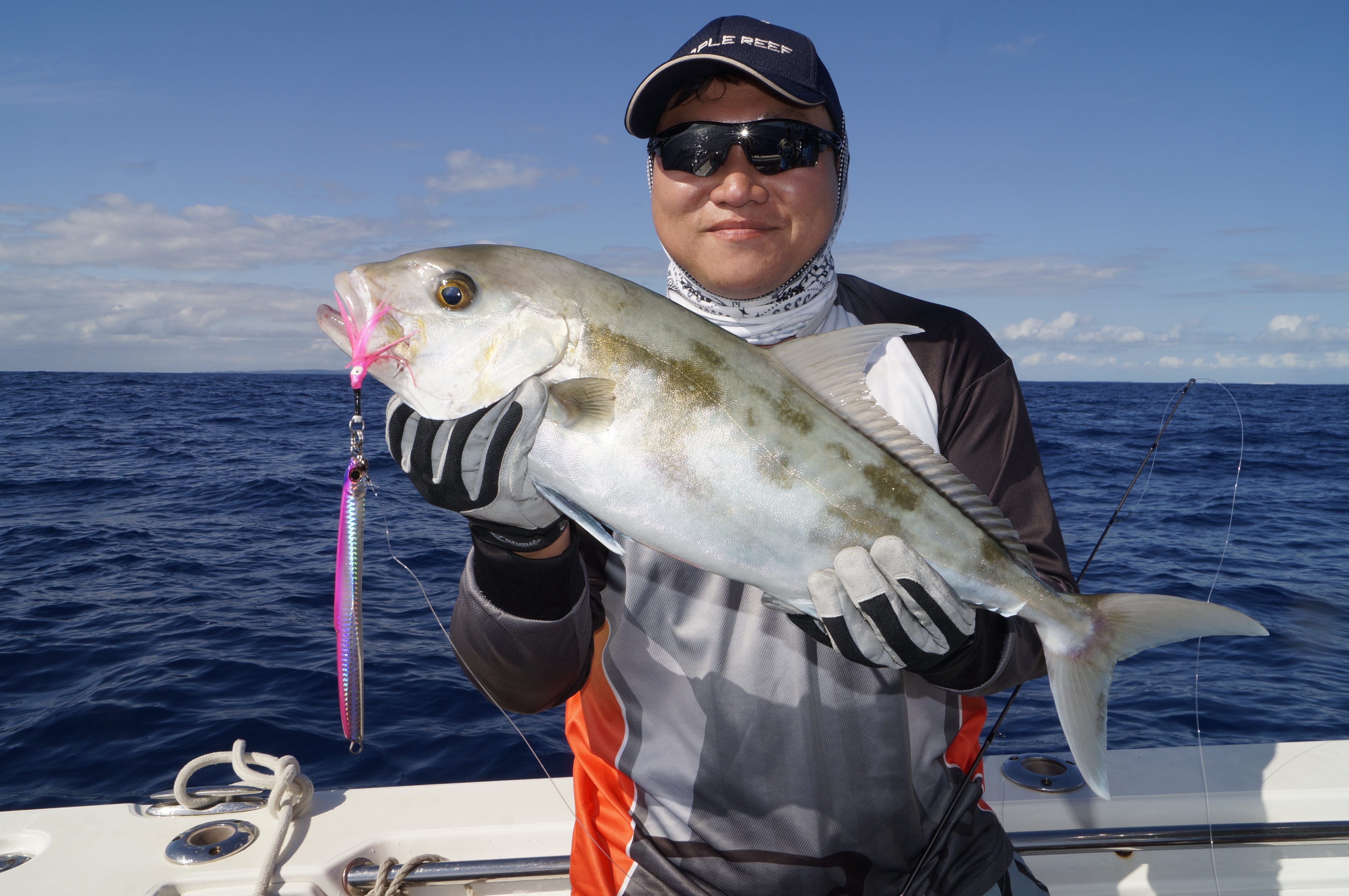 Glenn Han with a typical ambo jigged around a tightly packed bait school.