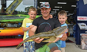 Jono McLachlan and his boys Beau and Jack caught a 66cm flathead off the beach near the Noosa Yacht and Rowing Club. Photos: www.fishingnoosa.com.au