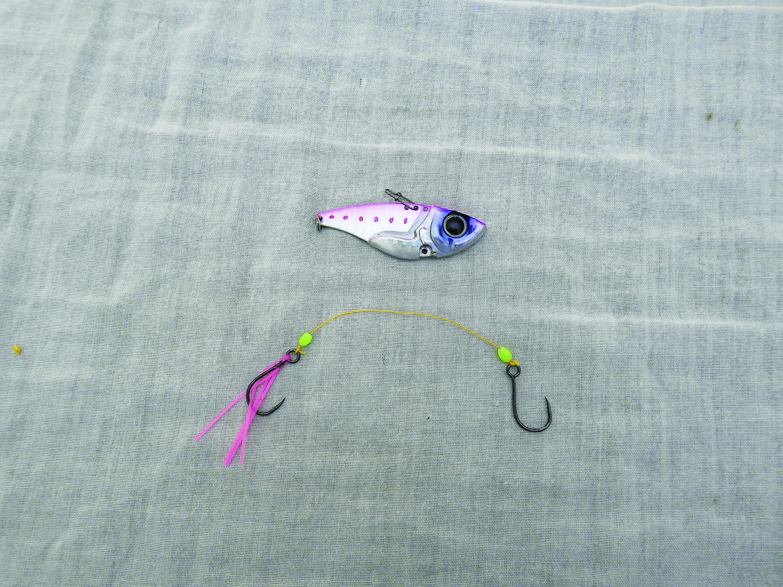 Tie on the dressed hook, any beads and then the plain hook.