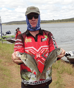 Gary McCabe of Brisbane with a pair of decent size bass.