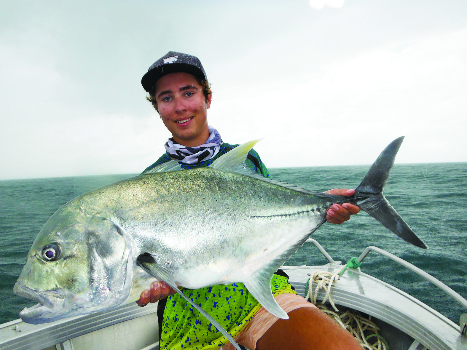 Matthew with a cracking giant trevally caught using a surface popper.
