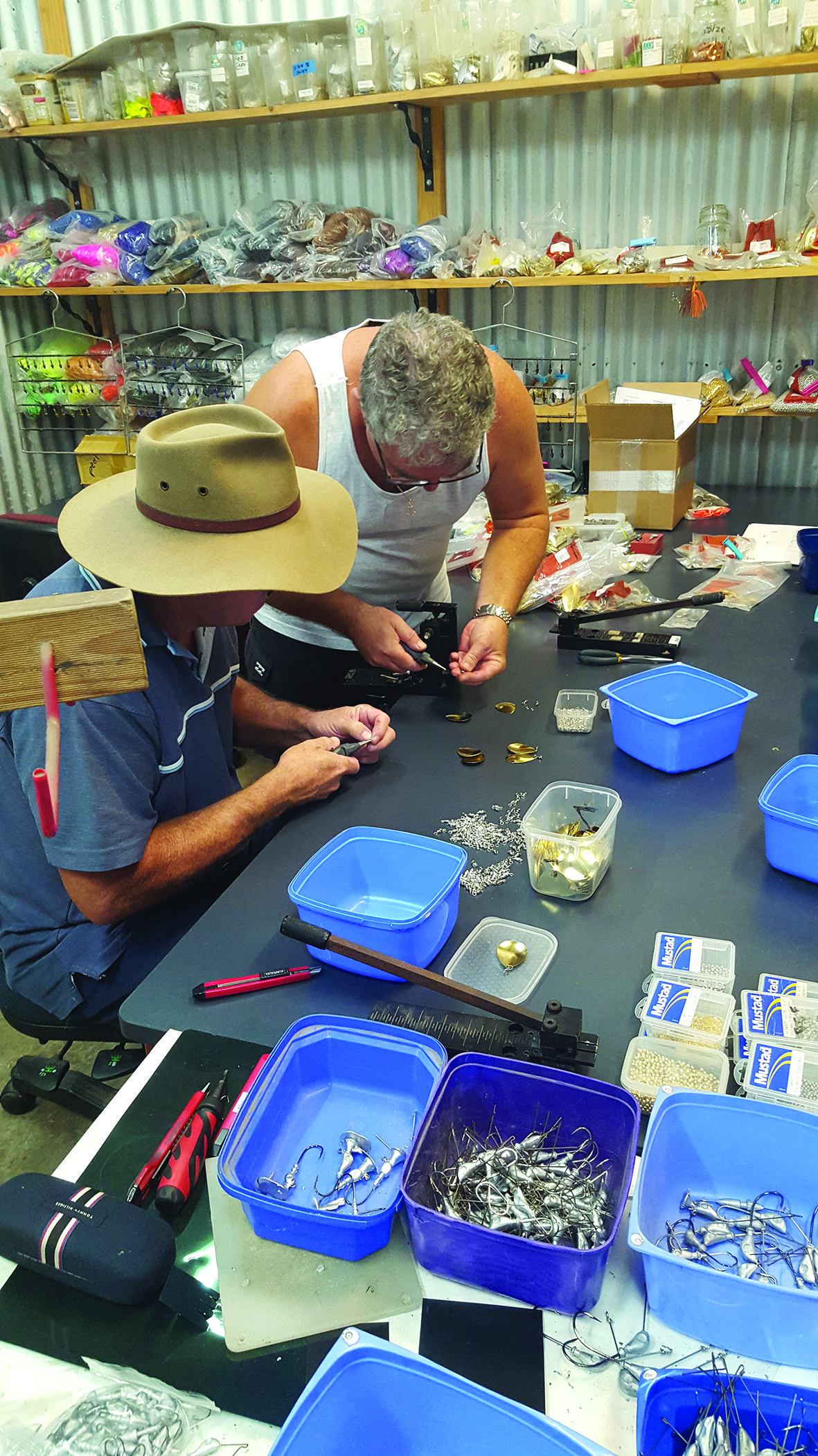 Glen of Bassman Spinnerbaits and an employee putting blades on jig heads.