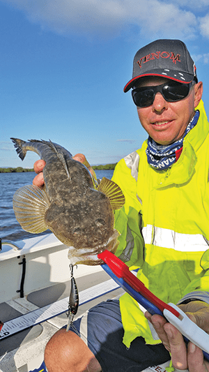 Colin with a flathead taken on a trolled Zerek Tango Shad around Jumpinpin. 