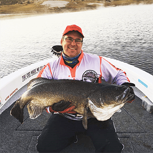 Scotty Fleming from Wilson Fishing with a 117cm Copeton bruiser taken on a mumbler.