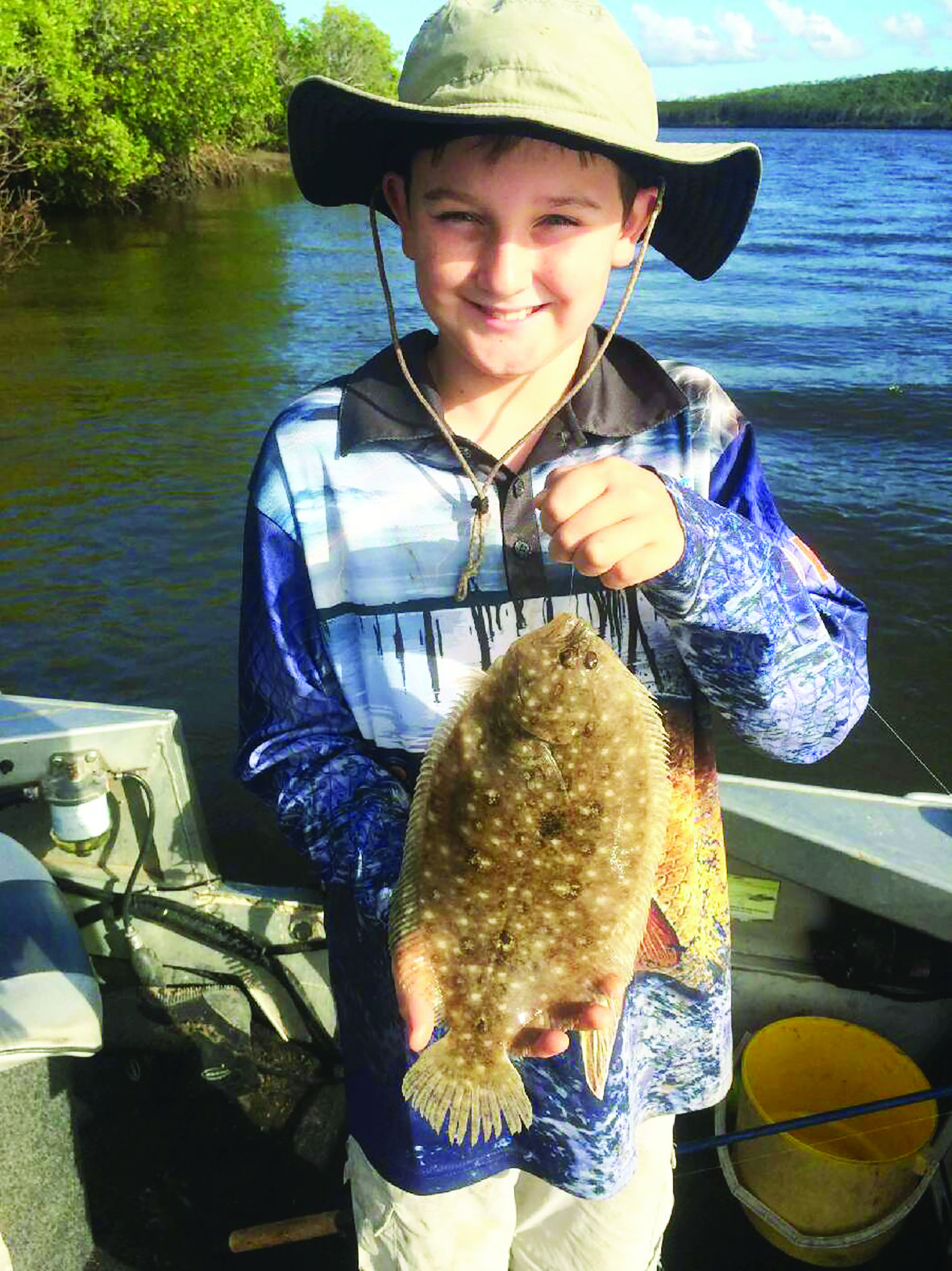 A happy little fisherman. The smile says it all!