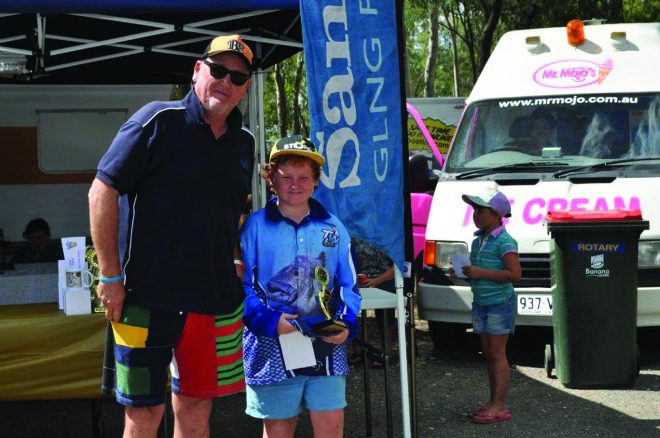 Santos representative Dean Salter presented Milton McGeachin with his prize for catching the biggest saratoga taken by a junior.