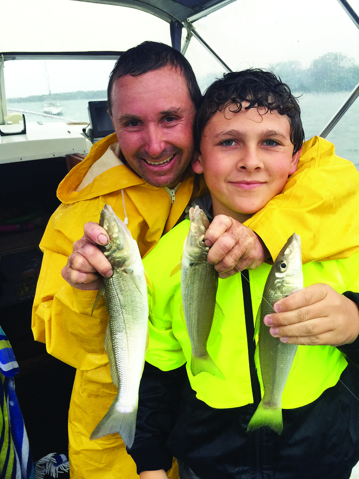 A very wet author and Cade with a few ripper whiting.