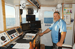 Scott Wilson, the most obliging skipper, in the wheelhouse of the Capricorn Star. 