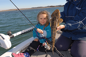 Selina looked pleased as punch with her first flathead caught by herself. 