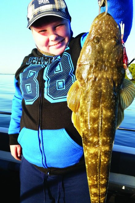 Hayden scored his PB 63cm flathead on a trolled hard-body.