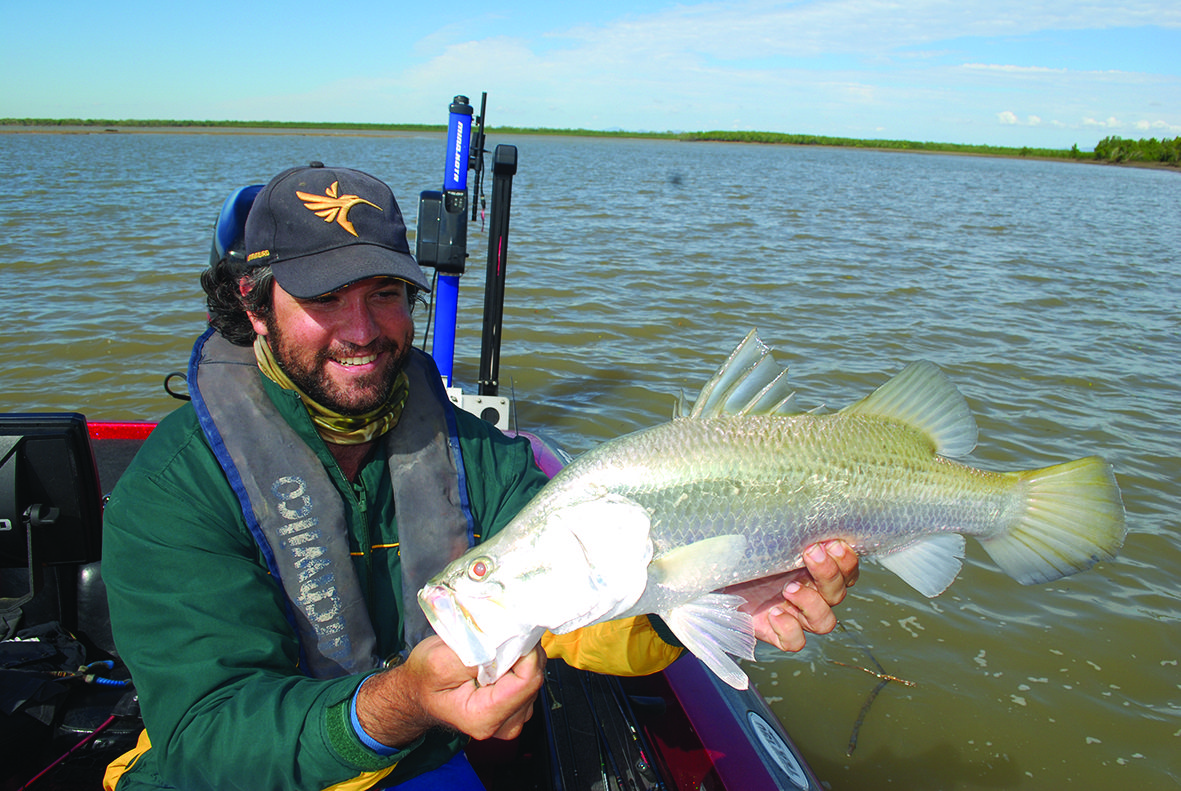 Karim De Ridder holding a great barra.