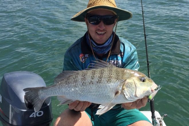Ben Cole with the 61cm grunter he caught on a soft vibe in the Burnett River recently.