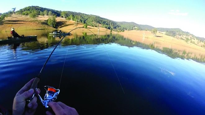 The author hooked up to a solid bass by vertical jigging soft plastics.