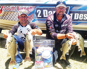 The author and dam manager Corey with a brace of bass that saw them place fourth in a recent teams tournament at Boondooma.