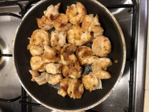 Cooking banana prawns.